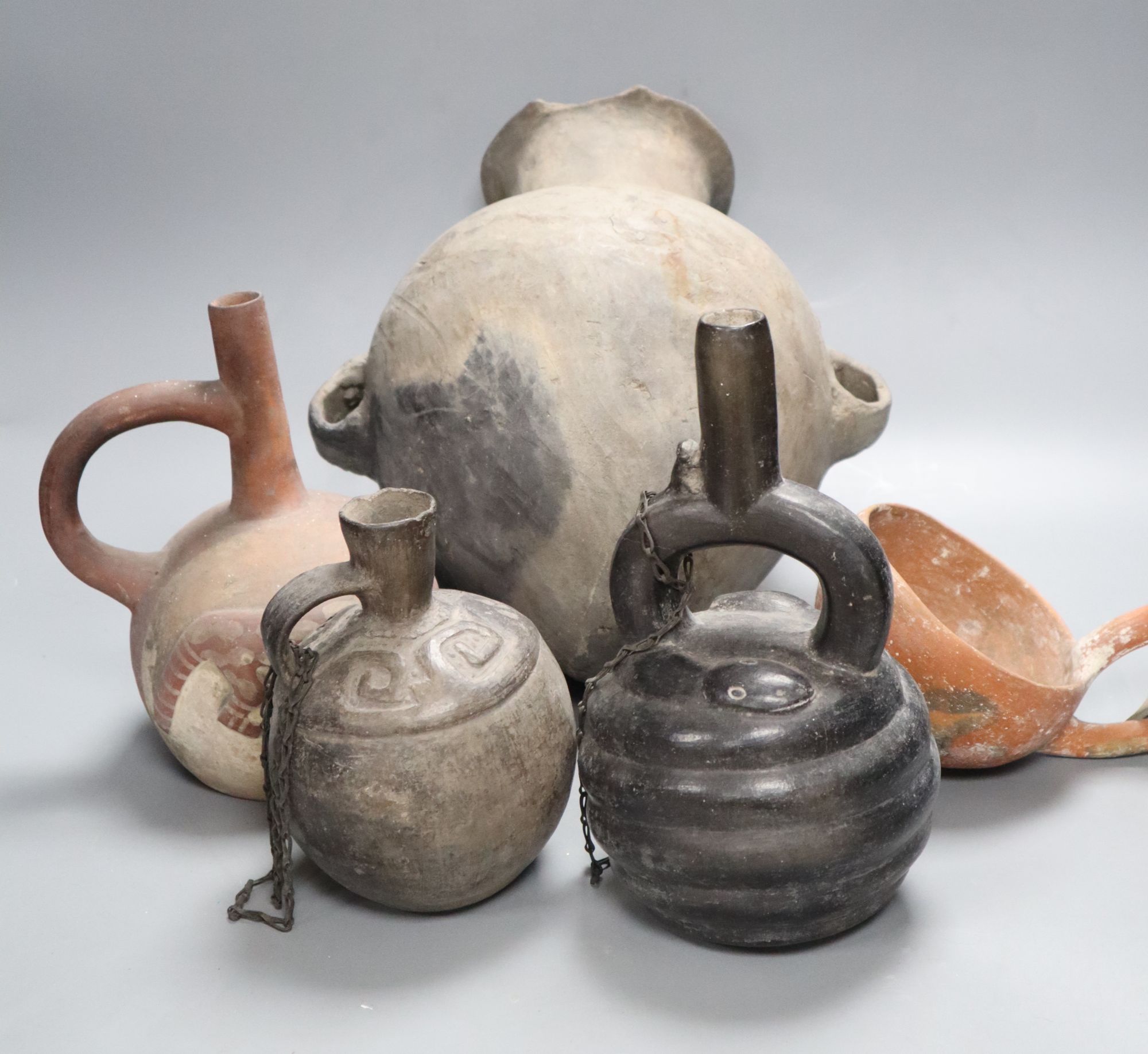 A group of five pre-Columbian or later pottery vessels